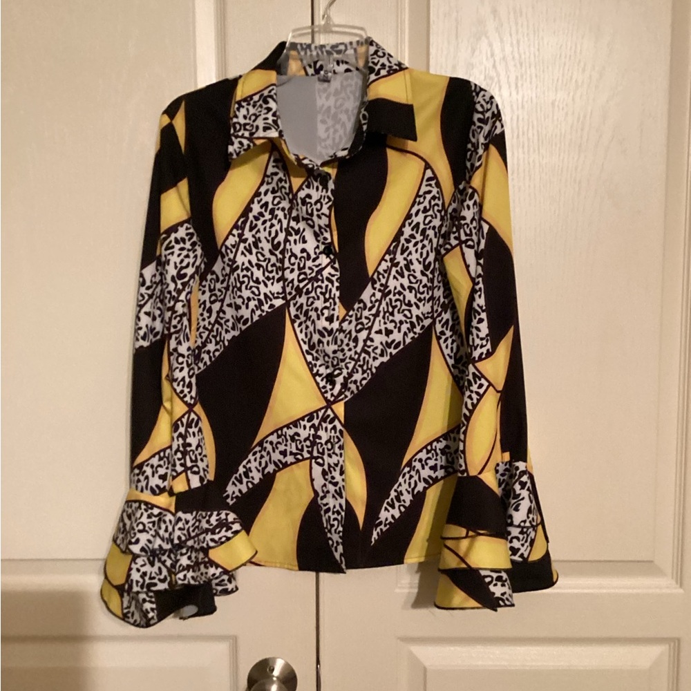 Fabulous black, white, & yellow blouse. Ruffles sleeves. Flattering.